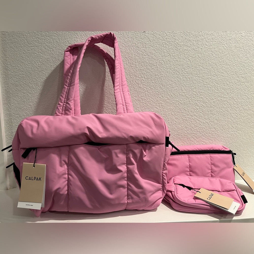 Calpak Luka duffle, toiletry, belt bag set in bubblegum NWT Discontinued color!